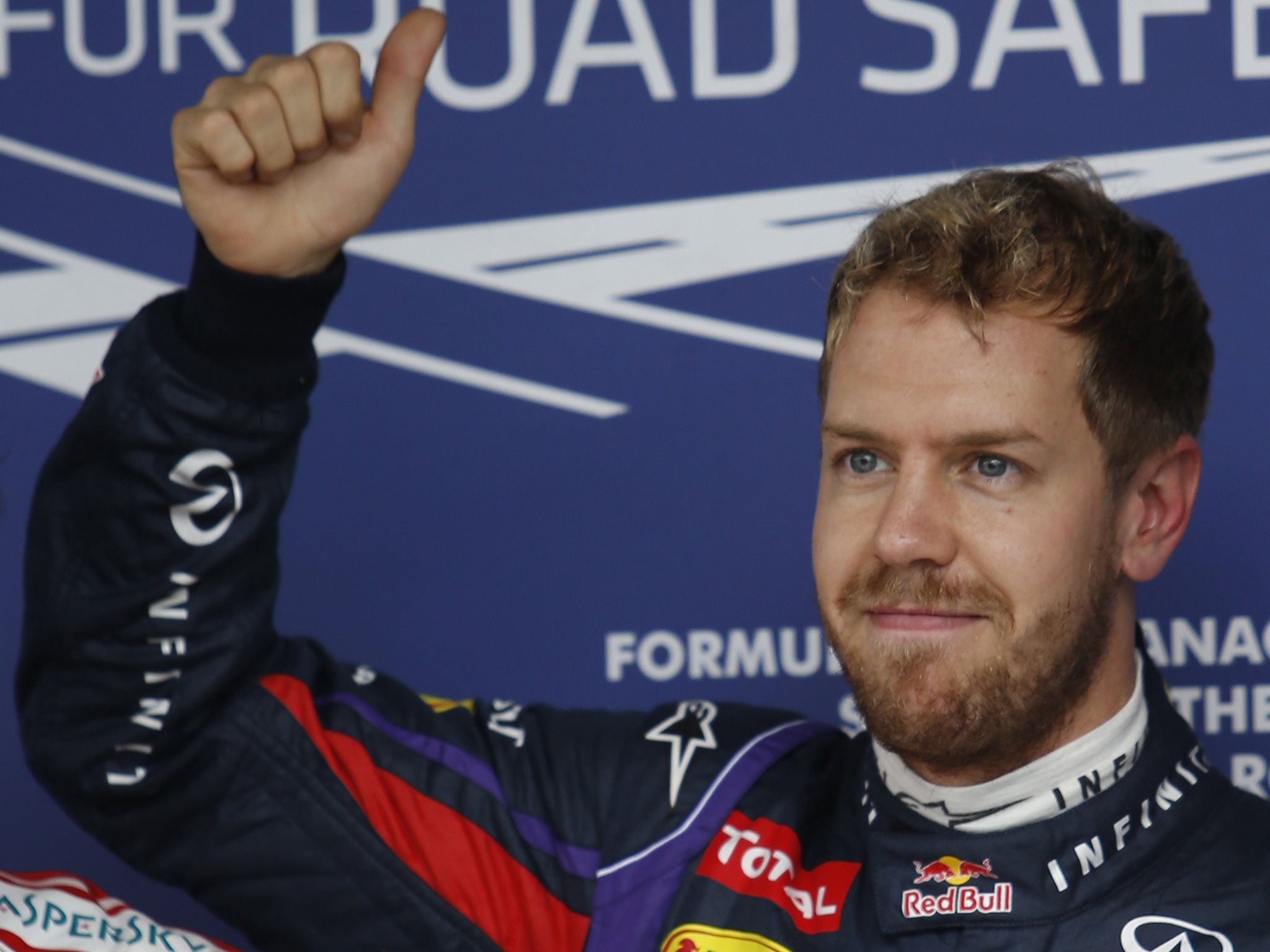 German Formula One driver Sebastian Vettel of Red Bull team celebrates after winning at the Interlagos racetrack in Sao Paulo, Brazil