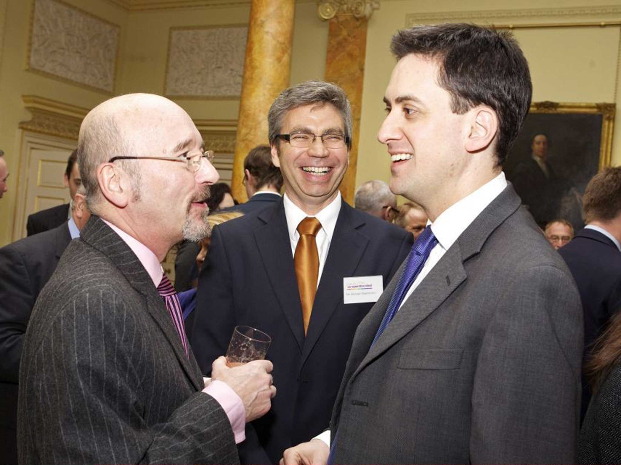 Old ties: Ed Miliband talks to former group Co-op chairman Len Wardle in Downing Street in 2010
