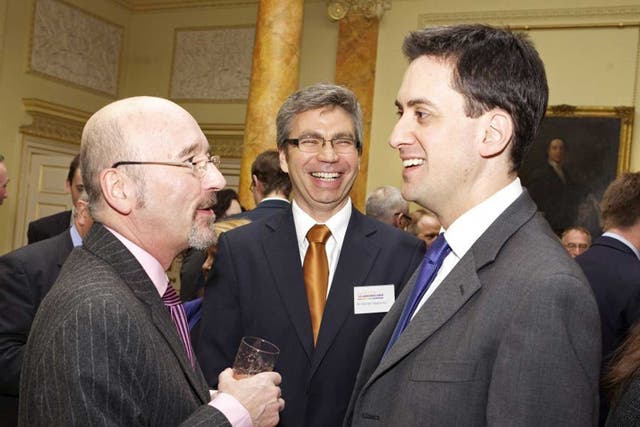 Old ties: Ed Miliband talks to former group Co-op chairman Len Wardle in Downing Street in 2010