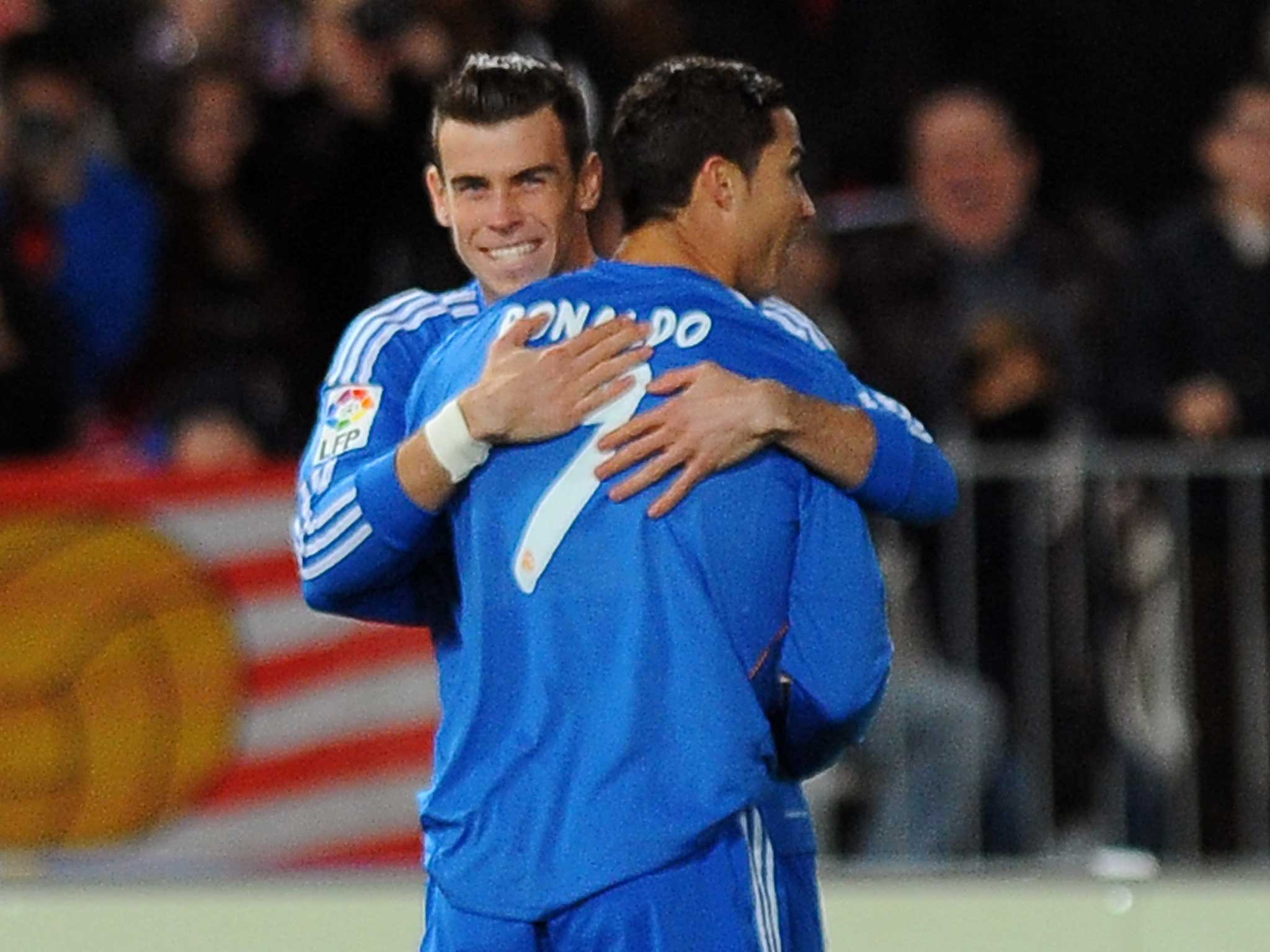 Gareht Bale and Cristiano Ronaldo share a hug during a recent game