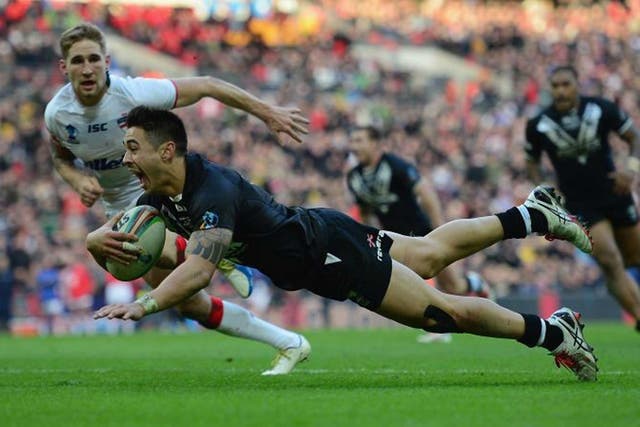 Kiwi polish: Shaun Johnson goes over in the last minute to score the winning try for New Zealand