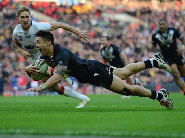 Kiwi polish: Shaun Johnson goes over in the last minute to score the winning try for New Zealand