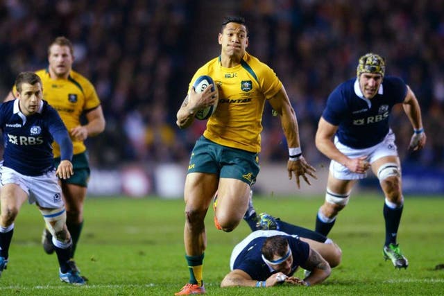Flying High: Israel Folau breaks away from Moray Low and fellow defenders to score his try