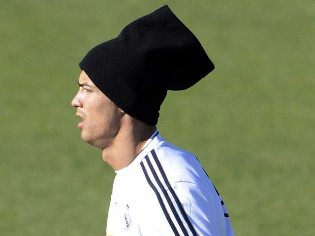 Cristiano Ronaldo sporting some unusually shaped head-wear during a session