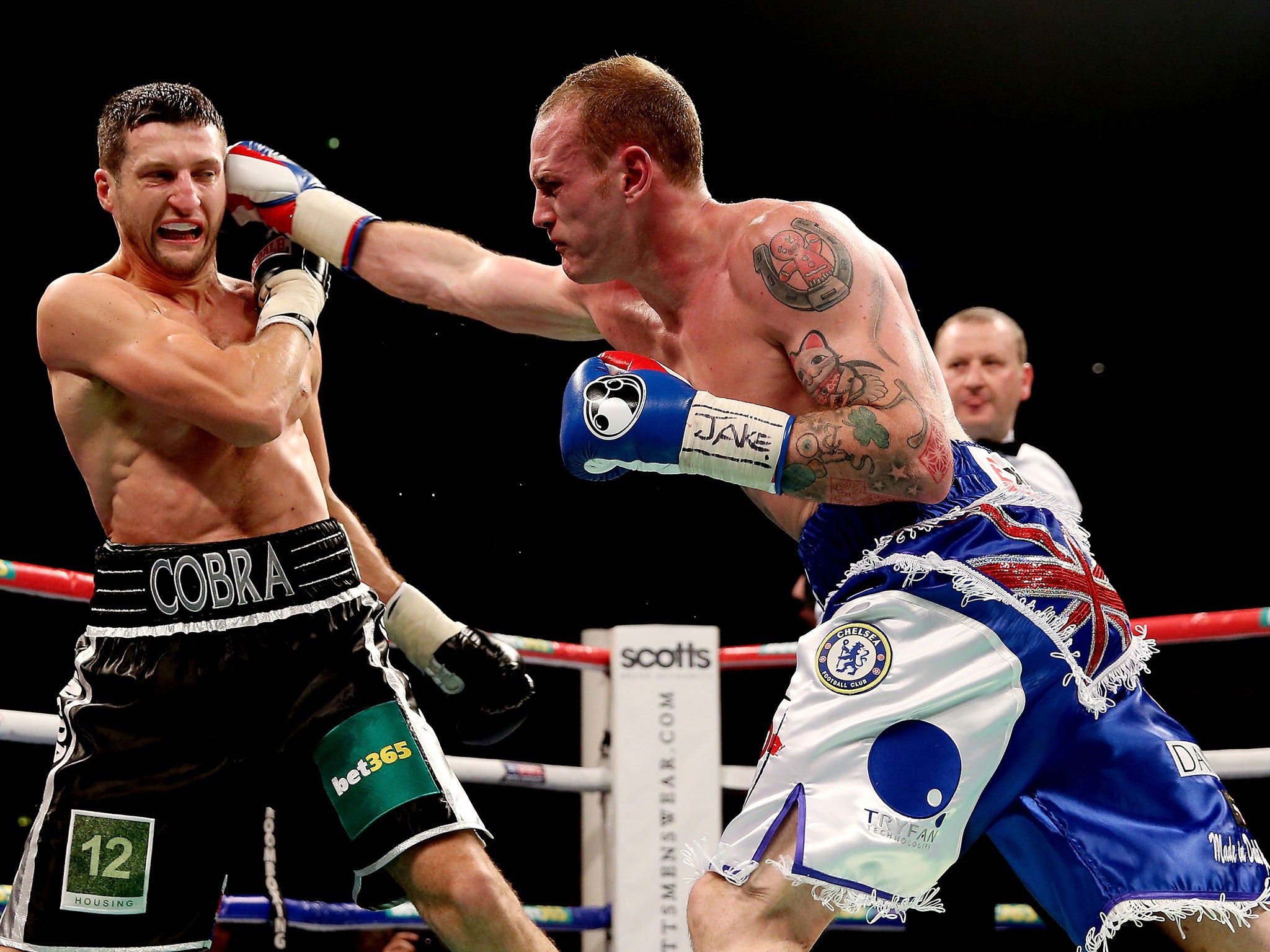 Carl Froch (L) in action with George Groves