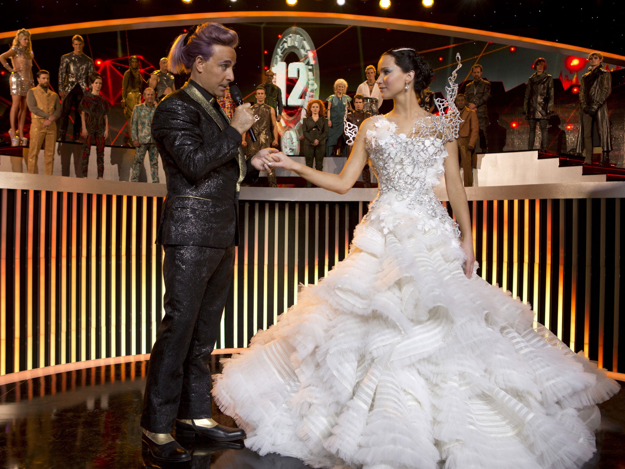 Glad hand: Stanley Tucci and Jennifer Lawrence in 'Hunger Games: Catching Fire'