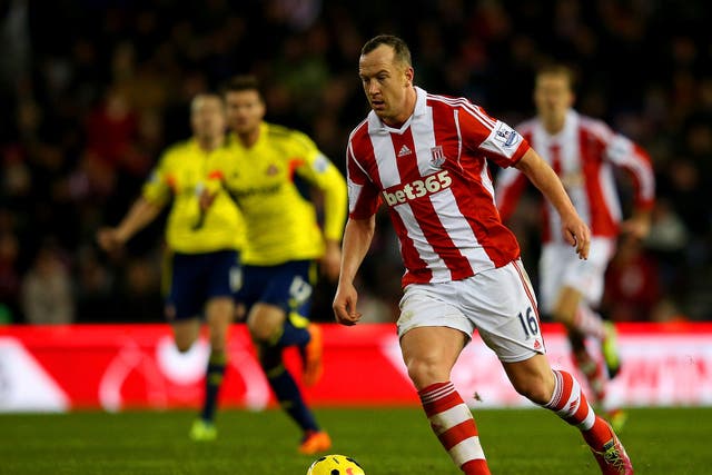 Charlie Adam of Stoke City runs with the ball