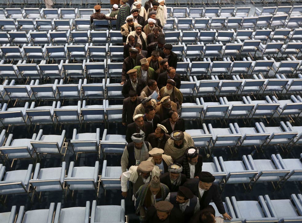 Members of the Loya Jirga, grand council, leave on the last day of the Loya Jirga in Kabul