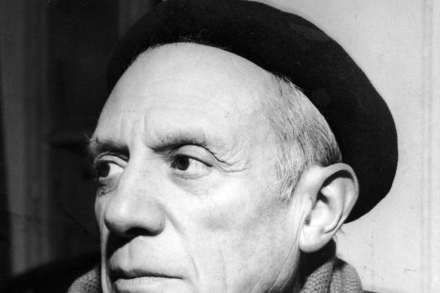 Portrait of Spanish-born artist Pablo Picasso (1881 - 1973) in a winter coat, scarf, and beret, 1950s
