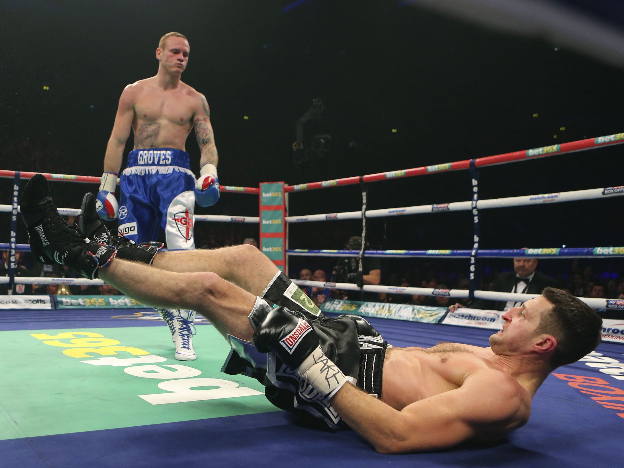 George Groves puts Carl Froch on the canvas during their super-middleweight title fight