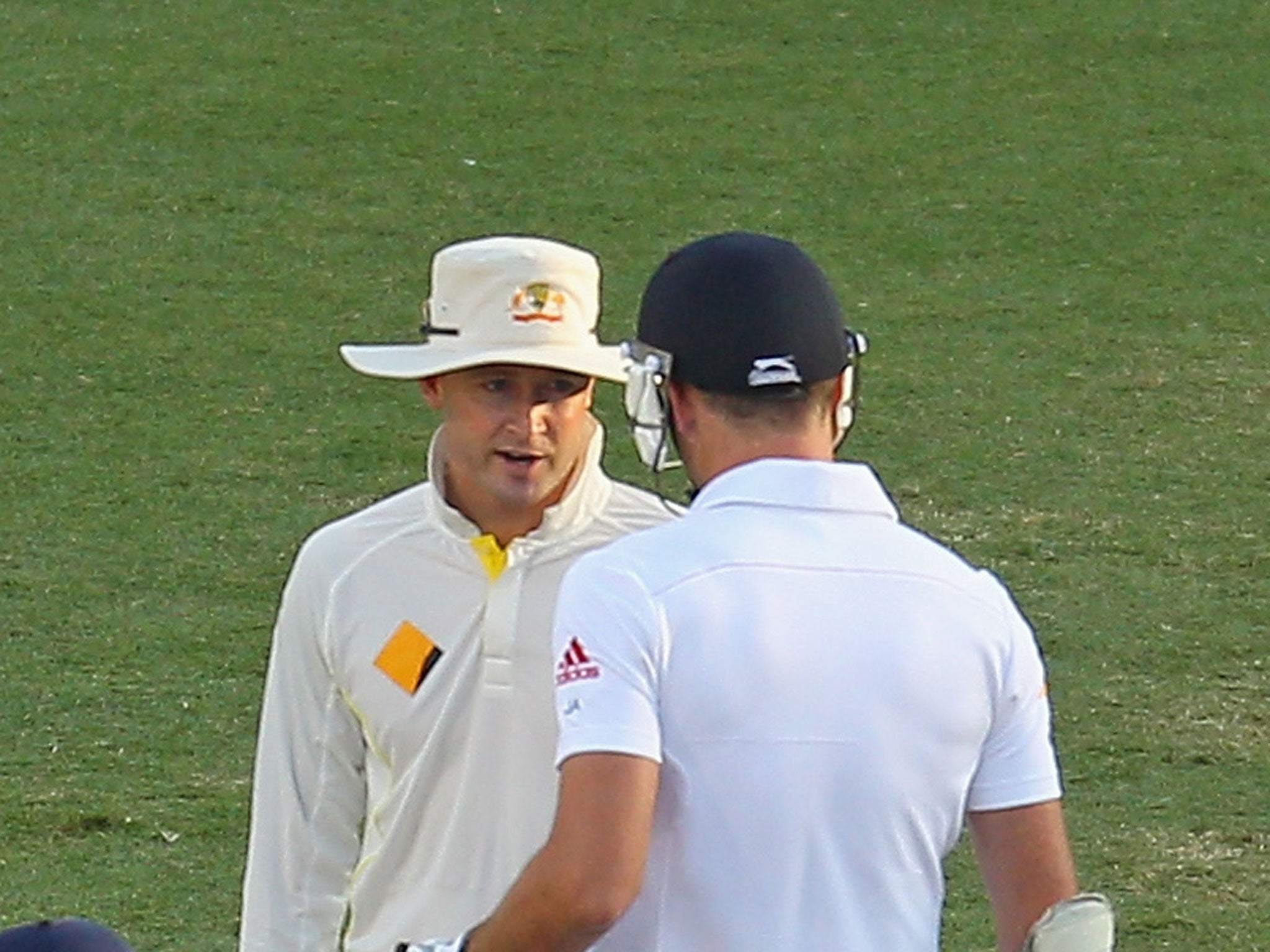 Australia captain Michael Clarke exchanges words with England's James Anderson