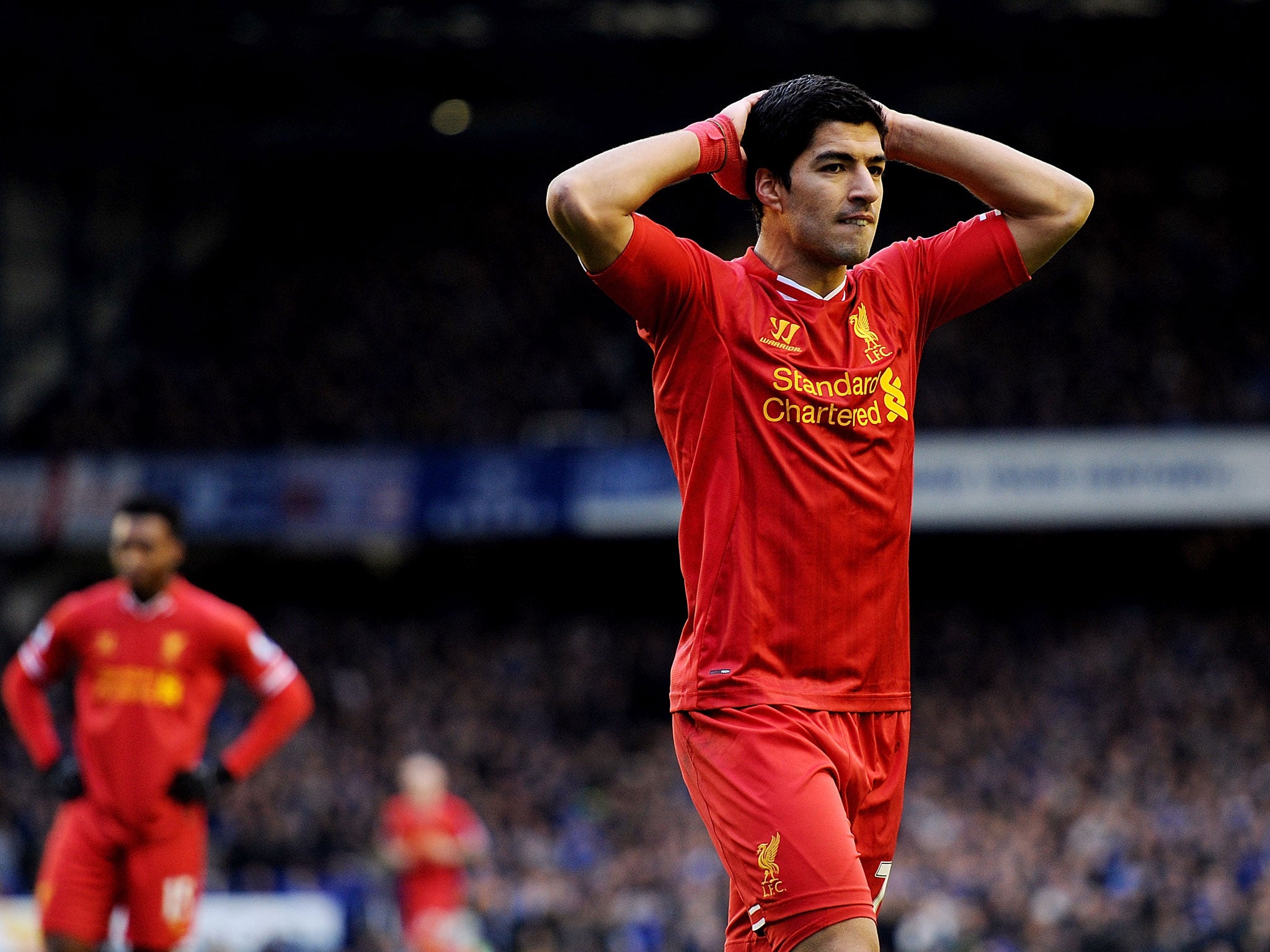 Luis Suarez looks dejected after missing a late chance to hand Liverpool victory against Merseyside rivals Everton