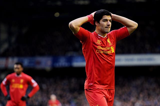 Luis Suarez looks dejected after missing a late chance to hand Liverpool victory against Merseyside rivals Everton