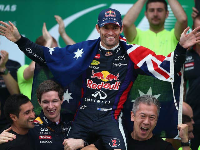 Red Bull mechanic hoist Mark Webber up on their shoulders after his final Formula One race in Brazil
