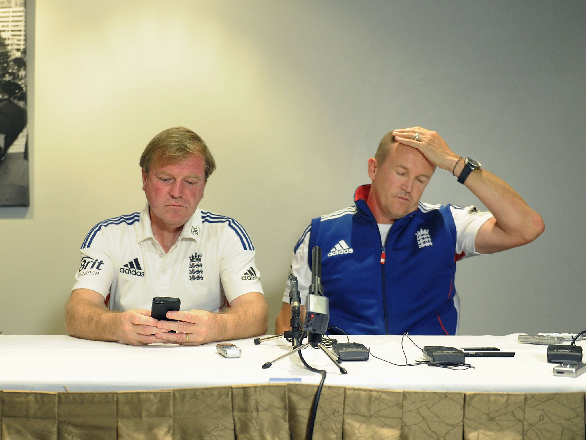 England's managing director of cricket, Hugh Morris (left), and head coach, Andy Flower, face the media in Brisbane following Jonathan Trott's decision to pull out of the Ashes tour