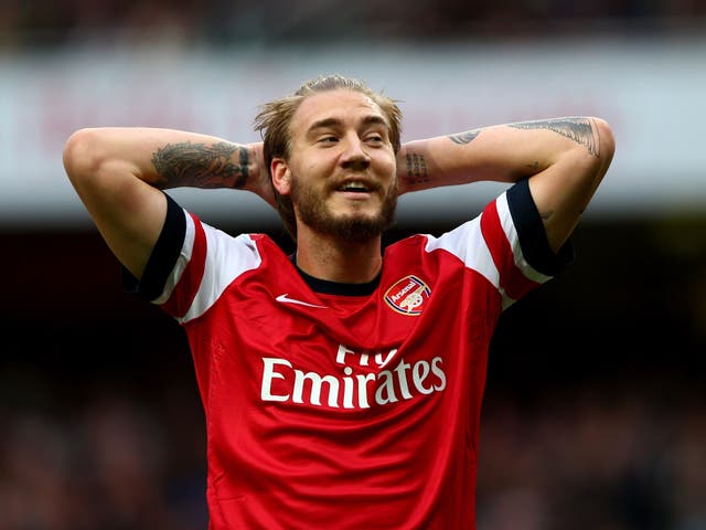 Arsenal striker Nicklas Bendtner has been given a caution after being arrested on suspicion of criminal damage