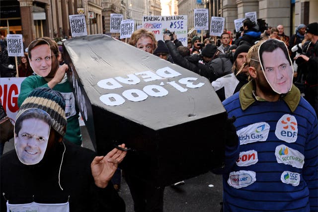 Protesters carrying a coffin to npower’s offices in London to highlight the number of deaths linked to the cold weather