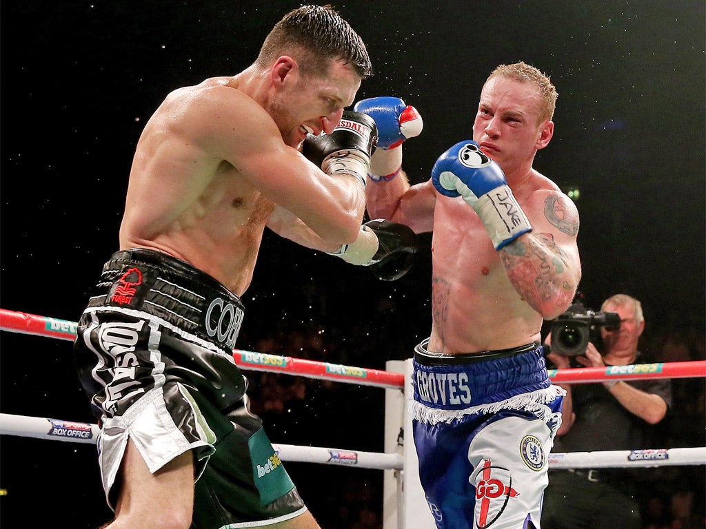 Carl Froch (left) takes a hit during his win over George Groves in their first fight in November