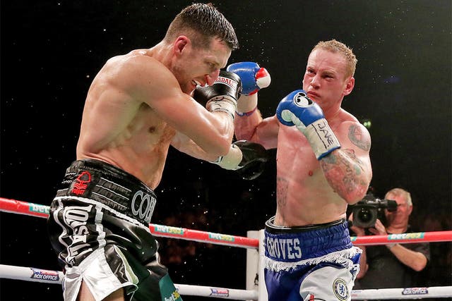 Carl Froch (left) takes a hit during his win over George Groves
