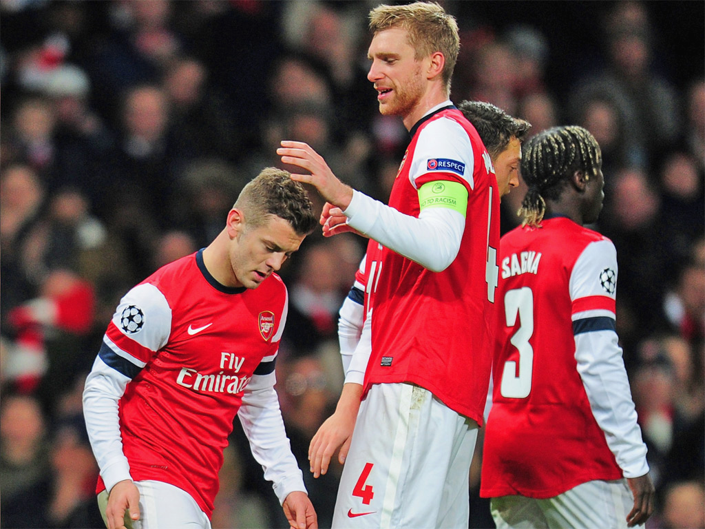 Jack and the beanstalk: Wilshere is congratulated by Mertesacker