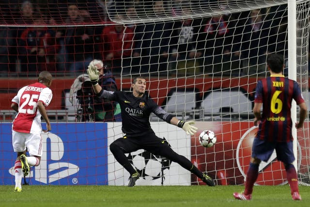 Ajax's Thulani Serero scores past Barcelona goalkeeper Jose Manuel Pinto
