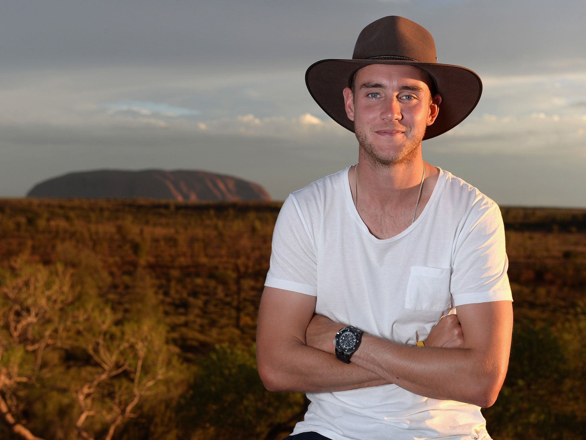 Stuart Broad pictured in Uluru, with the famous Ayers Rock in the background