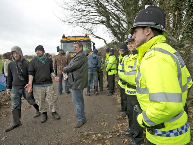 Protesters try to obstruct a lorry making its way down Barton Moss Road