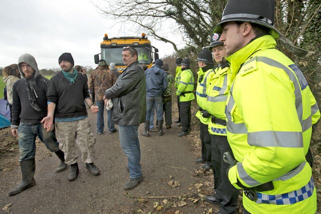 Protesters try to obstruct a lorry making its way down Barton Moss Road