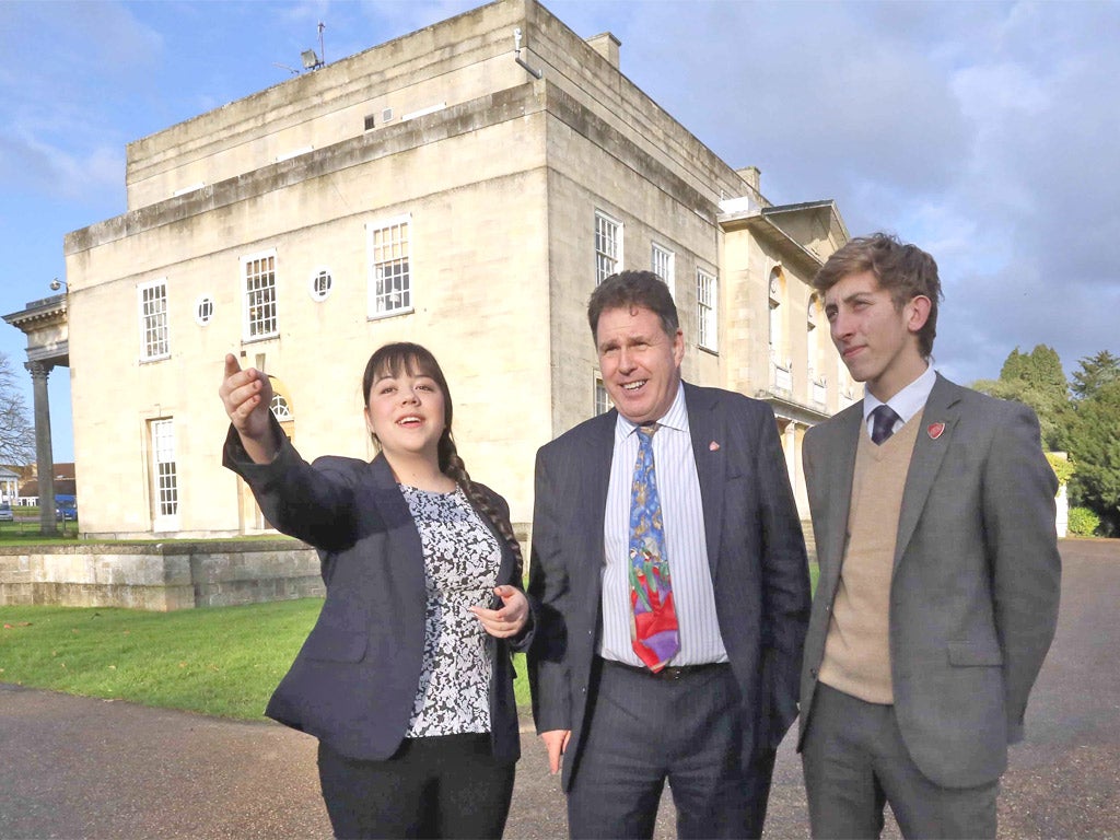 Head of house: headmaster Paul Spencer Ellis with sixth-formers Antonia Johnstone, 16, and head boy Jacob Sayers, 18, in the spectacular school grounds in Reigate, Surrey