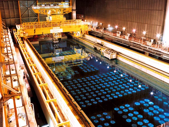 Barrels containing high level radioactive nuclear waste are stored in a pool to keep cool before being reprocessed at Sellafield nuclear plant