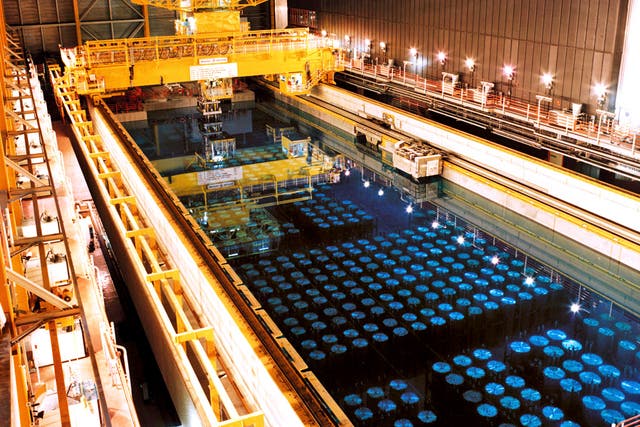 Barrels containing high level radioactive nuclear waste are stored in a pool to keep cool before being reprocessed at Sellafield nuclear plant