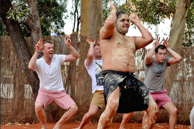 Graeme Swann takes part in an Aboriginal dance during a visit to
Ayers Rock