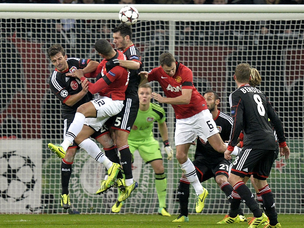 Emir Spahic guides Wayne Rooney’s free kick into Leverkusen’s net for an own goal