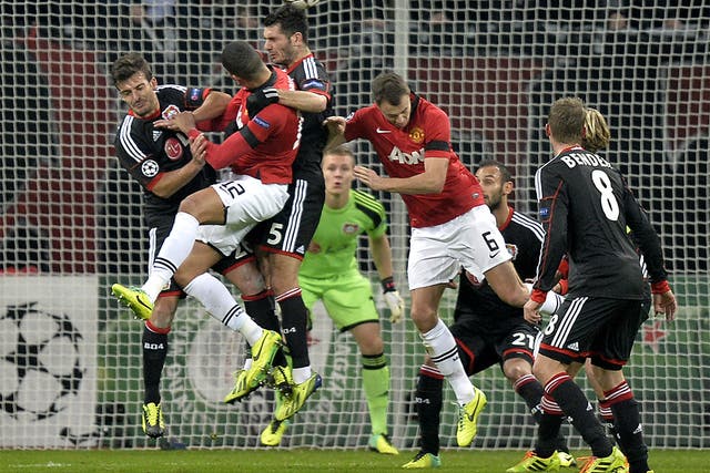 Emir Spahic guides Wayne Rooney’s free kick into Leverkusen’s net for an own goal