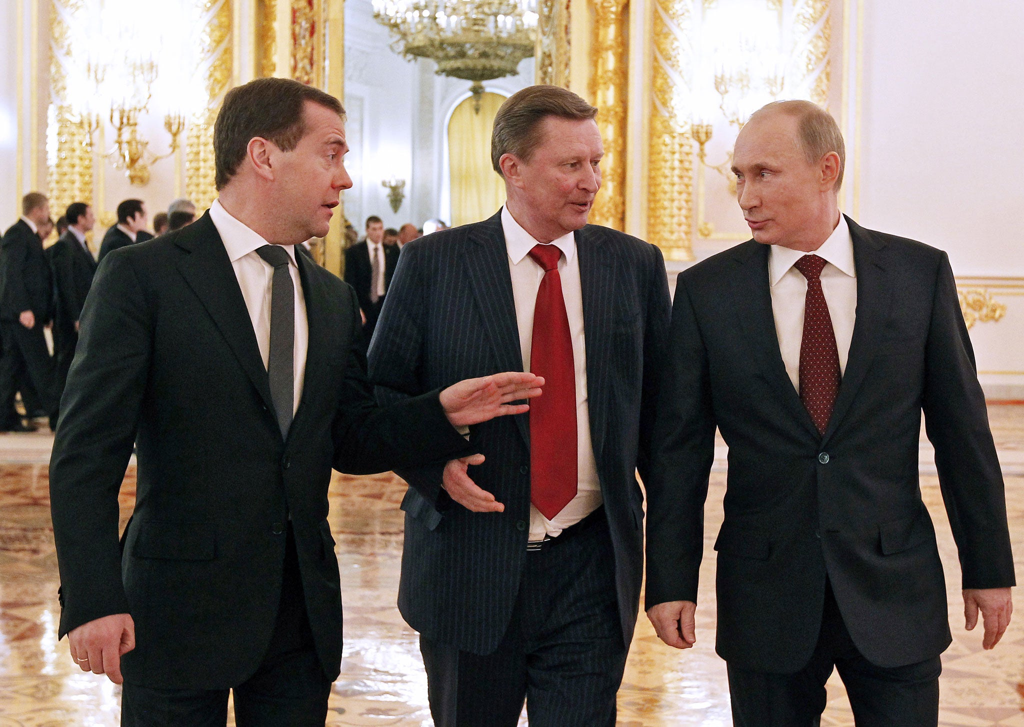 Sergei Ivanov stands in between Dmitry Medvedev and President Putin