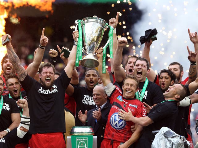 Jonny Wilkinson  (in red) and his Toulon team-mates hoist aloft the Heineken Cup after victory over Clermont Auvergne back in May 