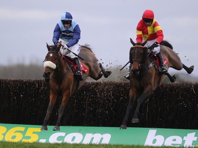 Wonderful Charm (left) wins the Berkshire Novices' Chase from Up To Something at Newbury