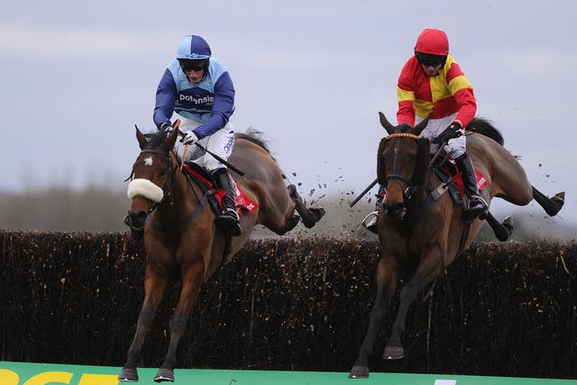 Wonderful Charm (left) wins the Berkshire Novices' Chase from Up To Something at Newbury