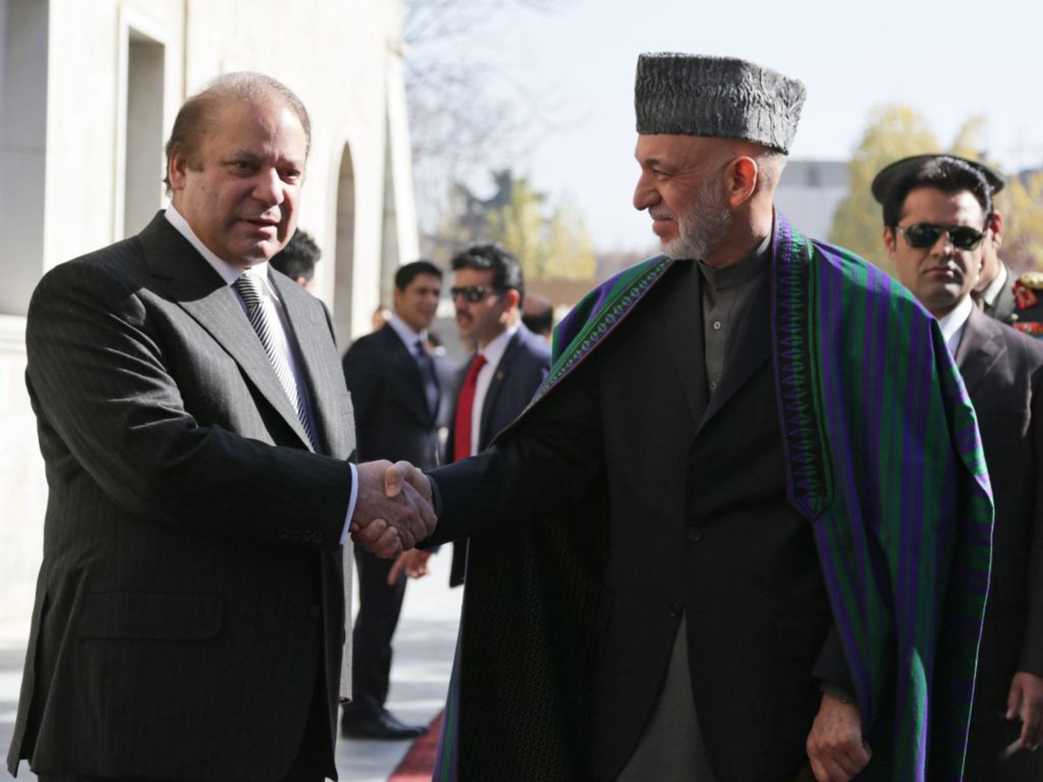 Afghan President Hamid Karzai with Pakistan Prime Minister Nawaz Sharif after talks in Kabul
