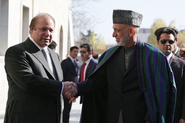 Afghan President Hamid Karzai with Pakistan Prime Minister Nawaz Sharif after talks in Kabul
