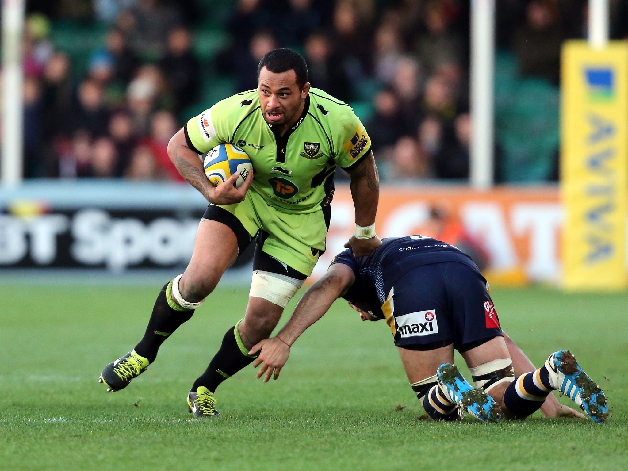 Samu Manoa of Northampton Saints charges past the Worcester defence