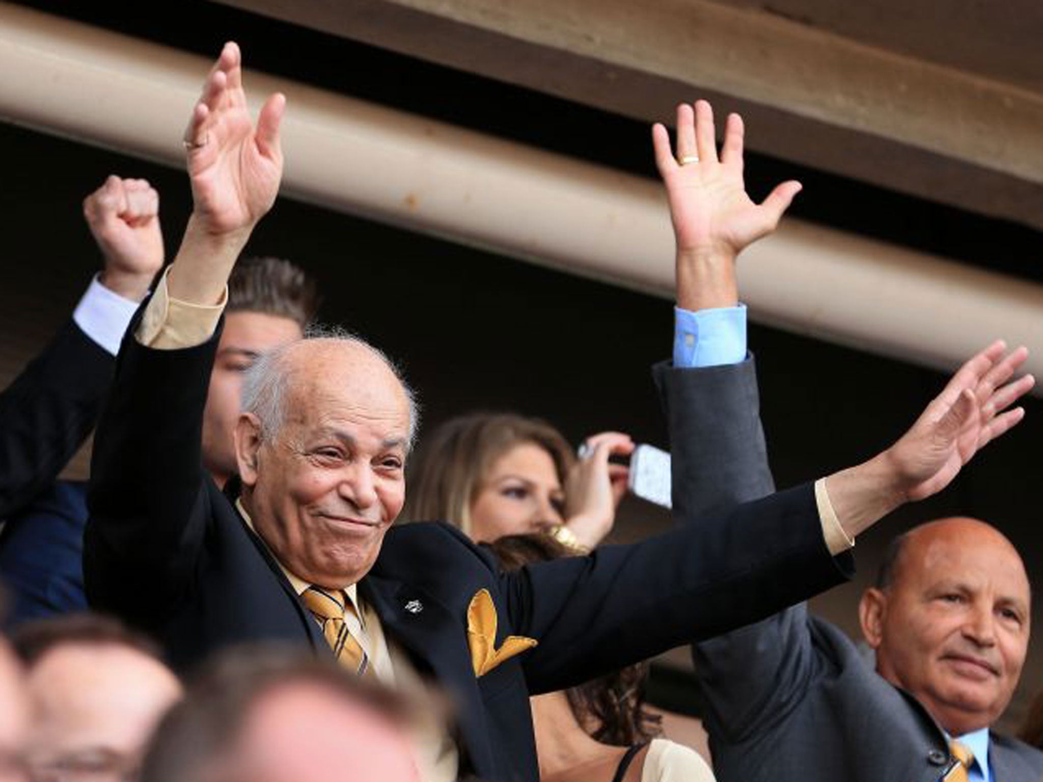 Assem Allam, left, is critical of fans who tried to unfurl a protest banner at the Palace game