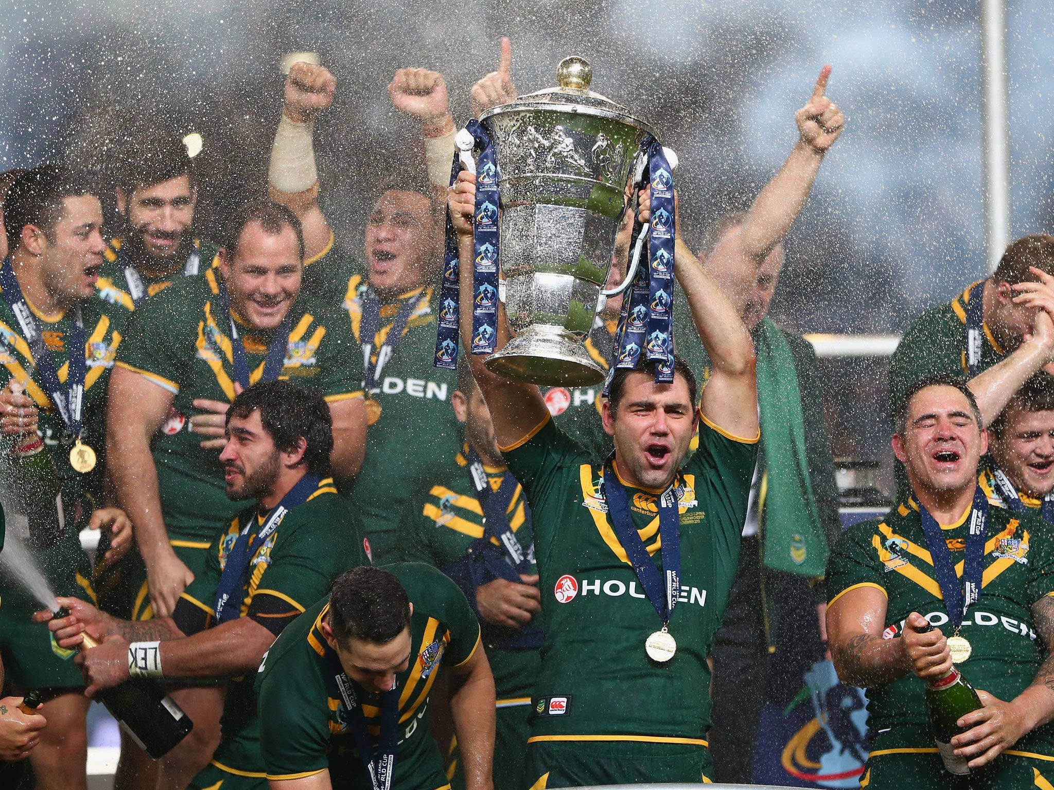 Captain Cameron Smith lifts the trophy