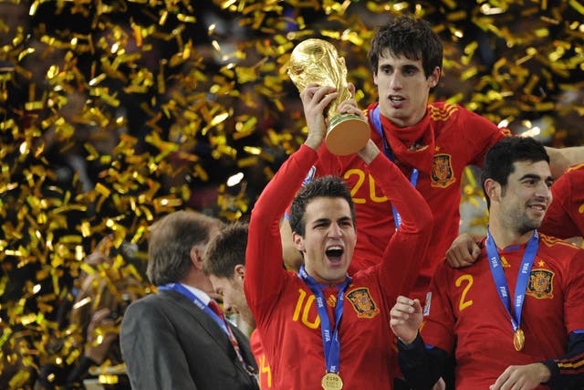 Cesc Fabregas hoists the World Cup aloft after Spain won the tournament in South Africa in 2010