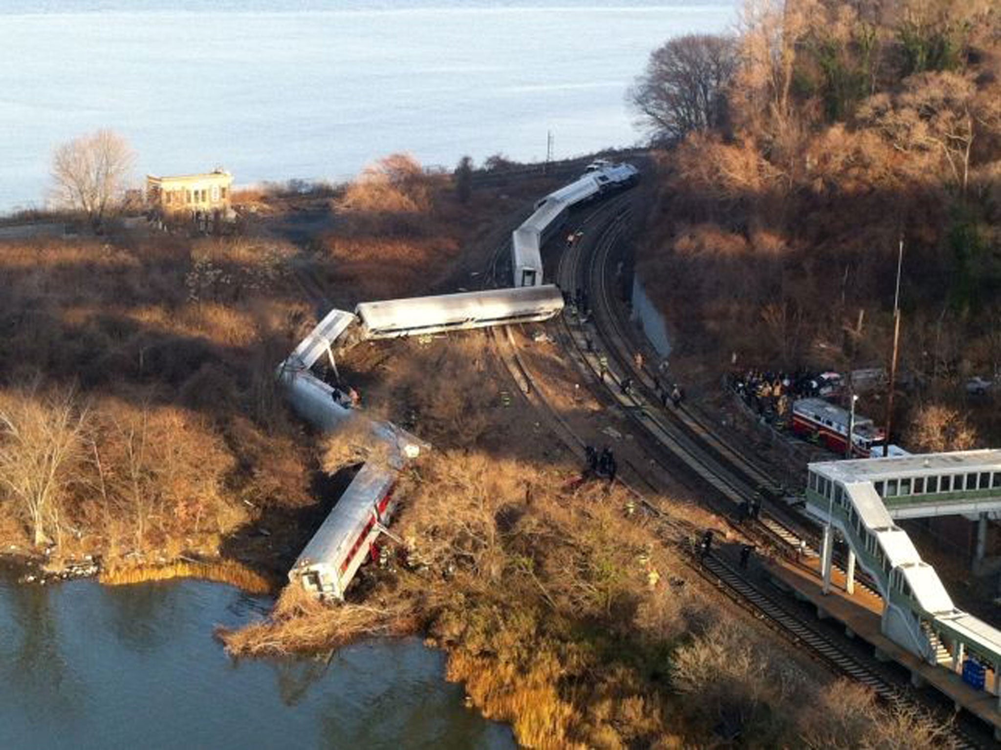 Cars from a Metro-North passenger train are scattered after the train derailed in the Bronx neighborhood of New York