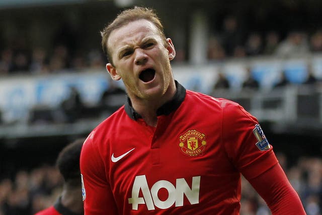 Wayne Rooney celebrates scoring his second from the penalty spot against Tottenham