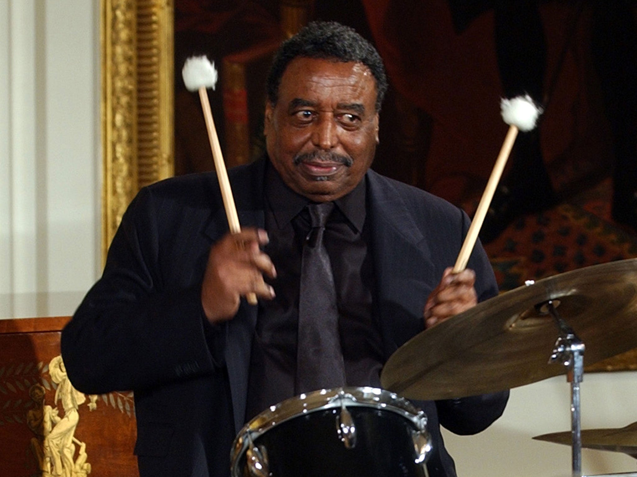 Hamilton performs a drum solo at the White House during a reception to honour Black Music Month in 2004