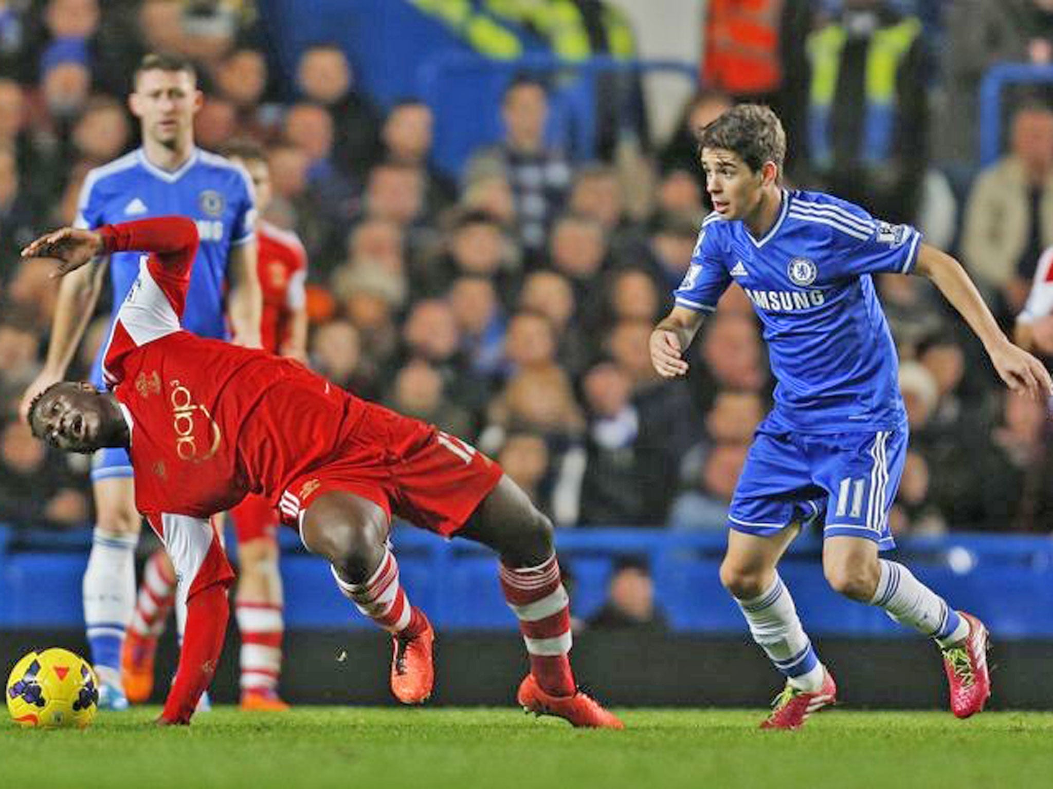 Chelsea's Oscar, right, fights for the ball with Southampton's Victor Wanyama, left, during their English Premier League football match at the Stamford bridge