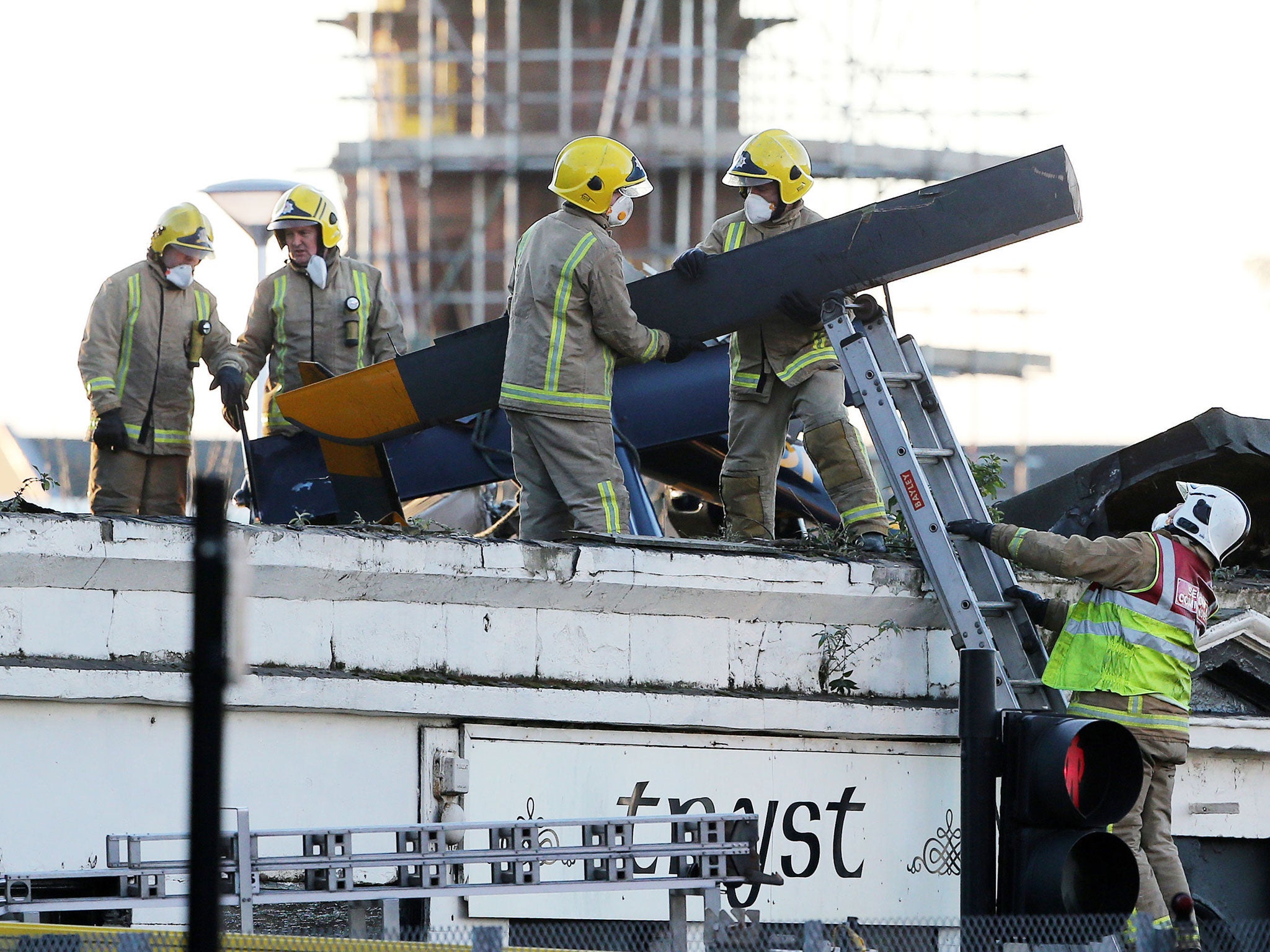 Emergency services remove wreckage, as work to recover bodies from the Clutha Vaults pub in Stockwell Street, near Glasgow city centre continues