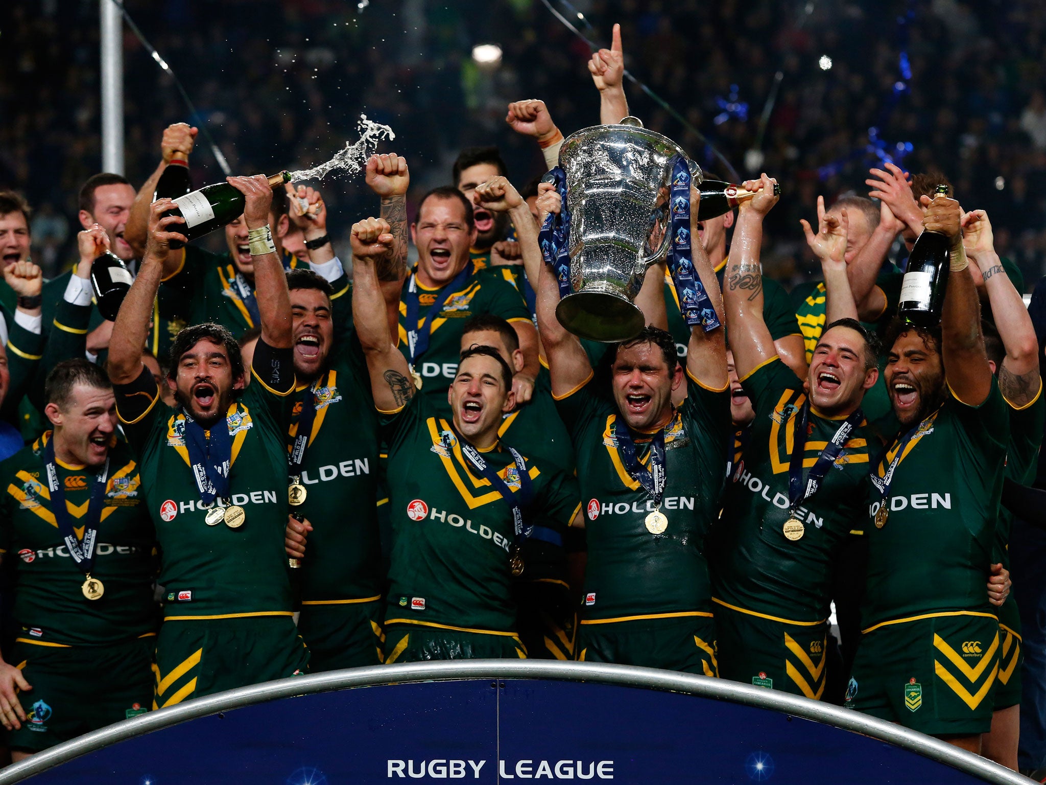 Victorious Australia players lift the World Cup at Old Trafford